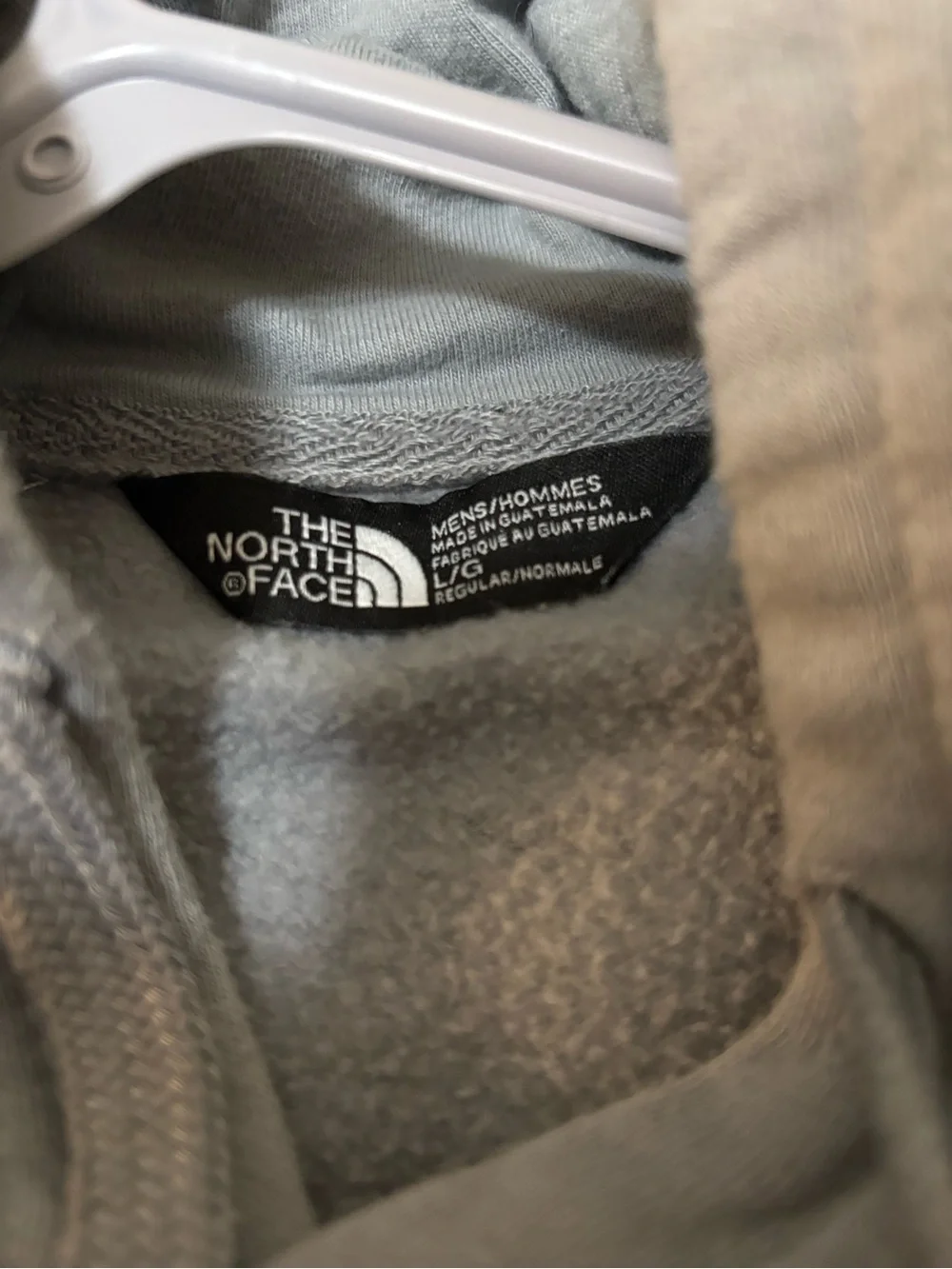 The North Face Light Gray Hoodie with Black Logo Tag